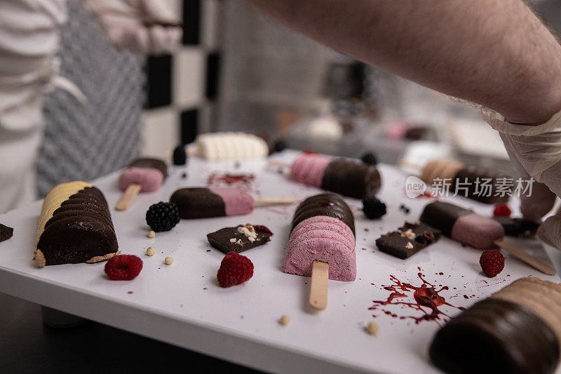 Chef decorating ice creams